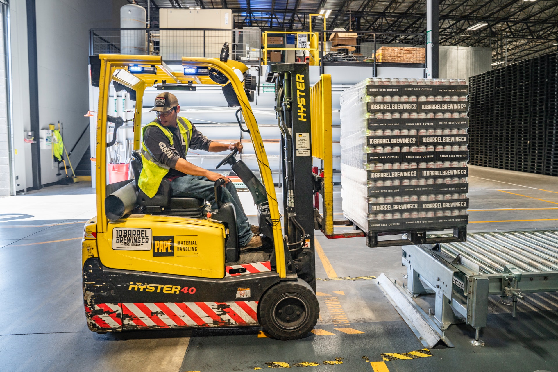 man on frontend loader warehouse 2